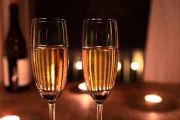 two glasses of champagne at night