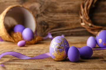 Beautiful Easter eggs on wooden table