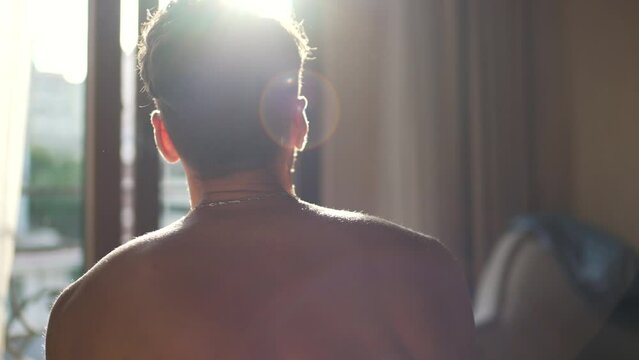 back view of a man after waking up