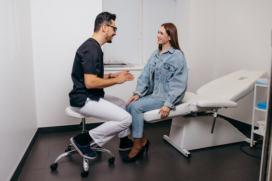 Young woman patient have consultation with doctor before exam