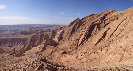 Desert landscape with almost vertical walls of the Small Crater in Negev desert, Israel. Steep walls of the Hamakhtesh Hakatan, a geological erosional landform of Negev desert.