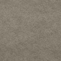 Dark gray recycled craft paper or cardboard texture as background