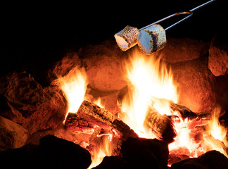Small fire with marshmallows roasting aboe