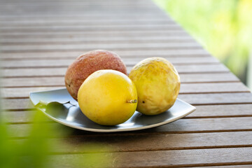 Exotic passion fruit on plate, tropical food