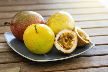 Exotic passion fruit on plate, tropical food