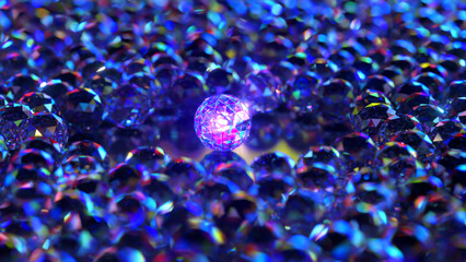 The concept of rarity and uniqueness. Large glowing diamond sphere surrounded by small diamond spheres. 3d Illustration