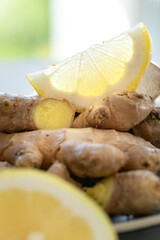 Ginger roots and lemon slices macro, copy space