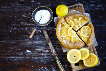 Selective focus. Galette with lemons. Healthy dessert. Citrus baking. Lemon tart.