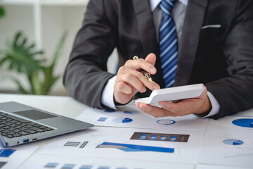 male accountant or banker making calculations. Savings money, Annual tax calculation finances, and...