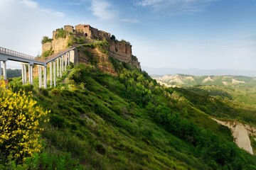 Fototapeta na wymiar Summer evening view of famous Civita di Bagnoregio town, beautiful place located on top of a volcanic tuff hill overlooking the Tiber river valley