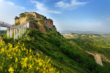 Summer evening view of famous Civita di Bagnoregio town, beautiful place located on top of a volcanic tuff hill overlooking the Tiber river valley