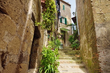 Fototapeta na wymiar The narrow streets of Sorano, an ancient medieval hill town hanging from a tuff stone over the Lente River. Etruscan heritage.