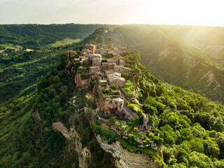 Aerial summer evening view of famous Civita di Bagnoregio town, beautiful place located on top of a...