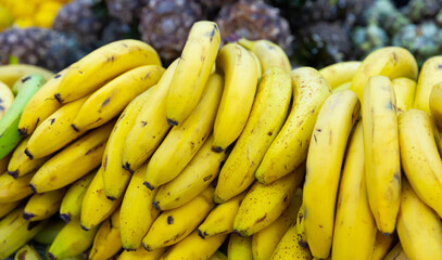 close up of mature bananas on counter in marketplace