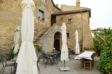 Old medieval streets of famous Civita di Bagnoregio village, located on top of a volcanic tuff hill...