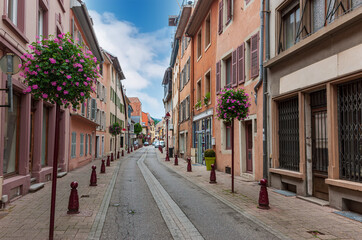 Old colored houses in city of Thann in Alsace France.