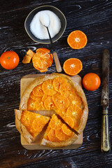 Selective focus. Galette with tangerines. Healthy dessert. Citrus baking. Tangerine tart.