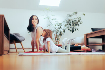 Mother and Daughter Exercising Together on a Yoga Mat