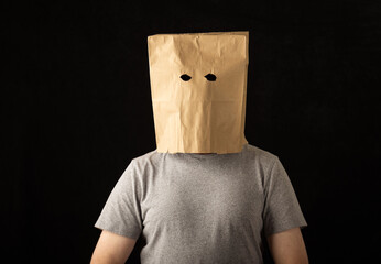 Man wearing a paper bag over his head
