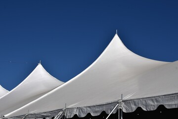 white tent on a blue sky background © Thomas Trompeter