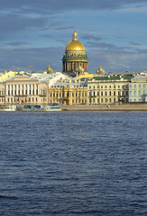 Fototapeta na wymiar English embankment of the Neva river. Dome of St. Isaac's Cathedral