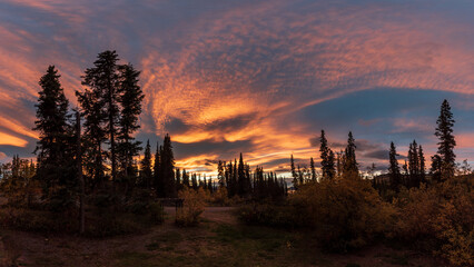 Stunning sky seen in northern Canada with blue poking out behind the orange, pink colored clouds...