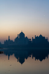 aj Mahal mausoleum reflected in Yamuna river - Agra, Uttar Pradesh, India