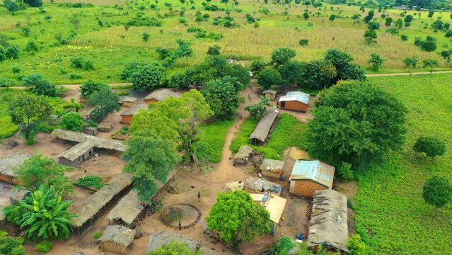Drone flying low over a village in Malawi, Africa.