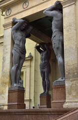 Naklejka premium Portico Of The New Hermitage. Stone figures of Atlanteans holding a cornice