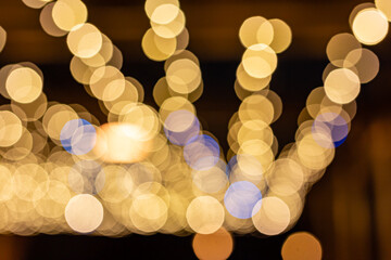 Golden bokeh background, glare of light in the form of circles