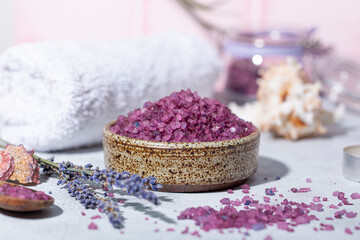 Obraz na płótnie Canvas Purple bath salt with lavender, towel and candles