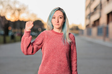 international signal for domestic violence help gesture symbol. SOS prevention mexican latin woman