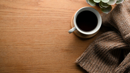 Cozy warm comfortable workspace with copy space on wooden background.