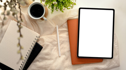 Cozy feminine workspace with tablet computer mockup.