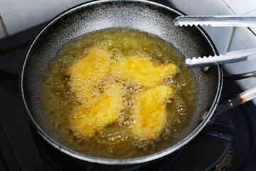 Top view of chicken nugget deep fried in the frying pan