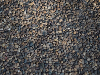 Abstract background with pebbles small round sea stones Beach rocks Texture material nature, Rock the specifics, grey black color