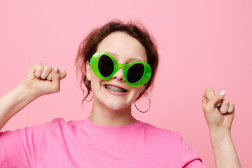 Stylish teenager girl model with green glasses decoration gesture with his hands