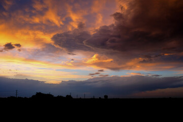 Beautiful sunset with golden orange clouds  background. Dramatic background.