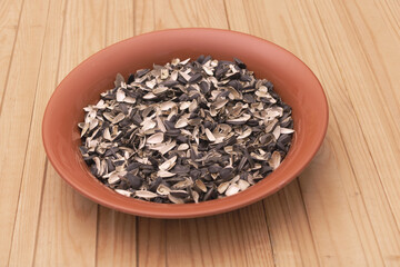 Close up shot of sunflower husks on wooden background