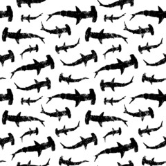 Seamless pattern of backlight sharks hammer. Black texture silhouettes on white background