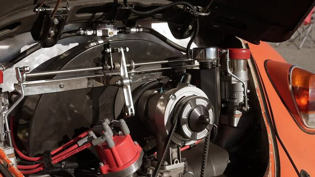 A small car modified rear-engine on a vintage economy automobile 