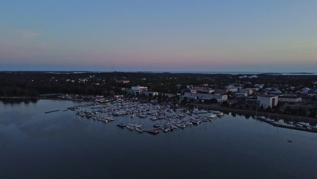 View over small boat harbour in Mariehamn city in Aland islands in Finland, orbiting shot