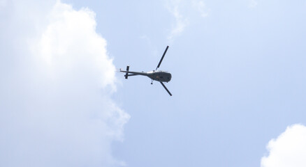 Helicopter in the sky. Against the backdrop of dim skies