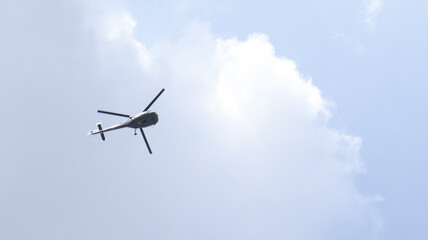 Helicopter in the sky. Against the backdrop of dim skies