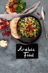 Fresh Tabbouleh salad on dark background.