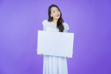 Portrait beautiful young asian woman with empty white billboard