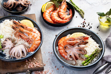 Shrimps with rice on light gray background.