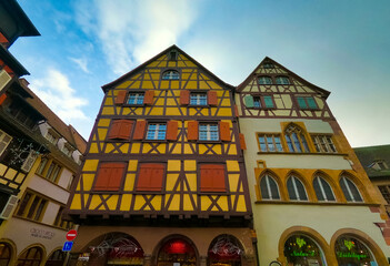 Colmar, Petit Venice, narrow street and traditional half timbered colorful houses.
