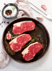 Grilled fish, seafood and meat assortment on light background.