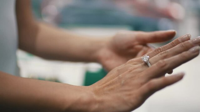 woman trying on a diamond ring